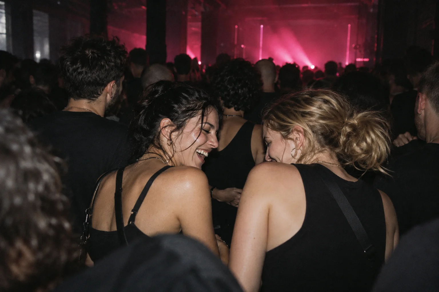 An imagined moment between friends on a dark dance floor